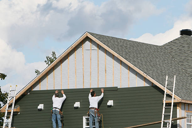 Professional Siding technician working in Burke, VA